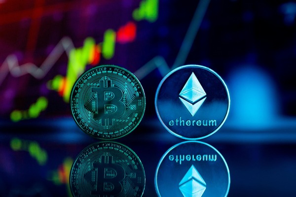 Bitcoin and Ethereum coins with a market chart