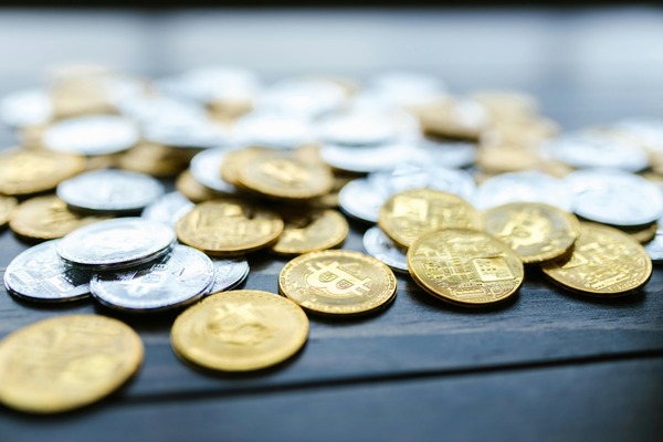 Gold and silver crypto coins on a table
